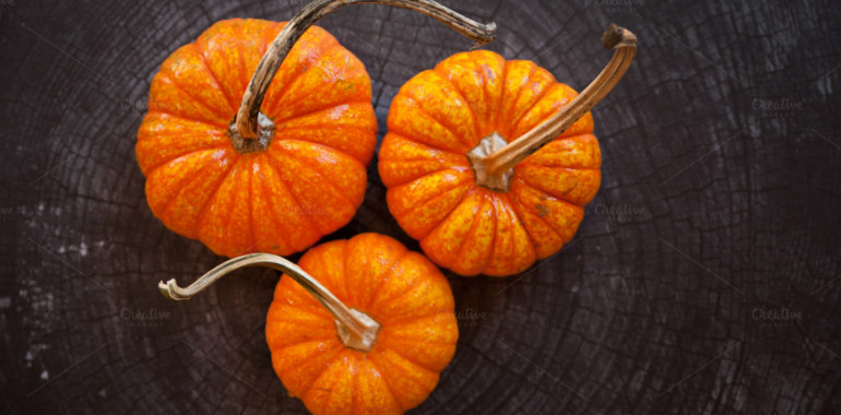 Three pumpkins on wood. Autumn