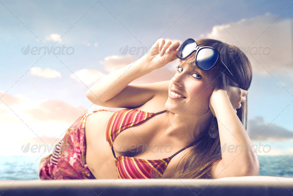 Beautiful Woman Lying on a Beach
