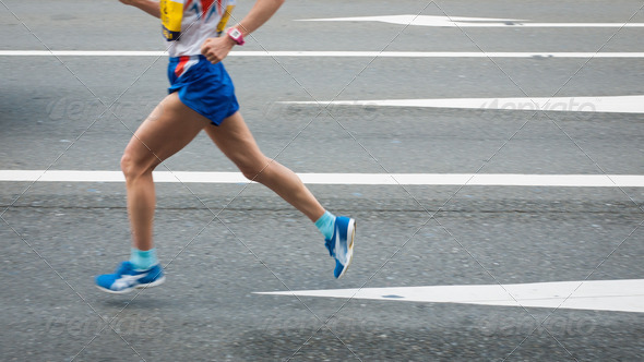 Marathon runners on the Road. Motion blurred