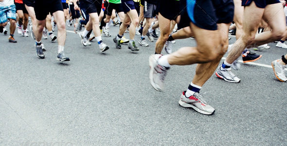 Runners running in city marathon