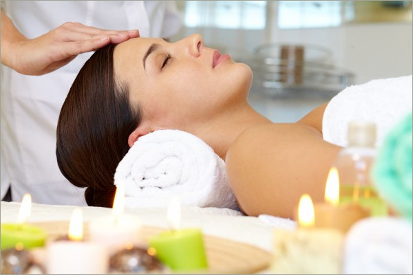 young woman receving facial massage