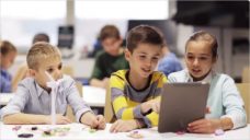 Kids with Tablet Pc Programming at Robotics School