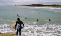 Windsurfers on the breakwater