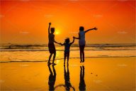 Dancing on the beach at sunset